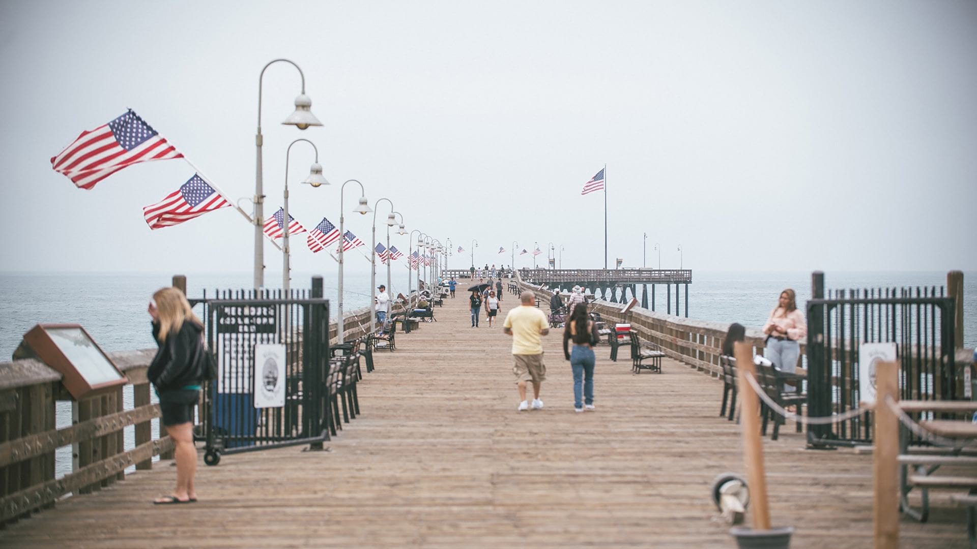 People walking on a pier in the daytime